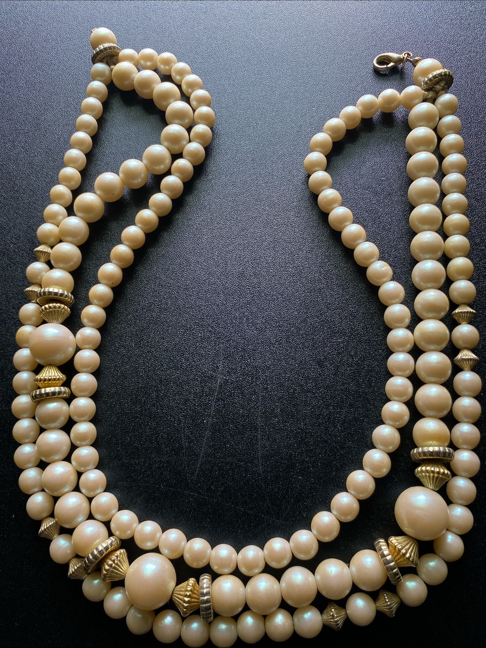 Elegant Cream Pearl Triple-Strand Necklace with Gold Accents